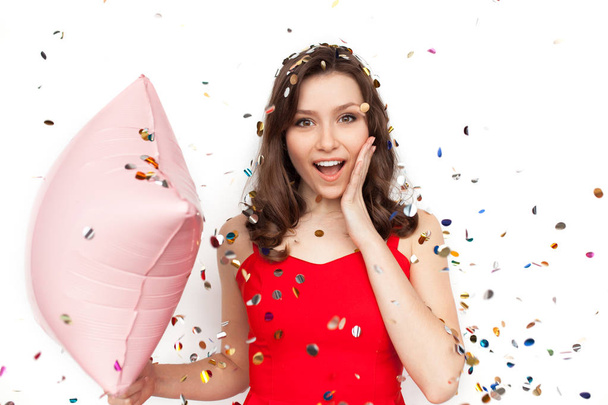 Young woman with balloon in confetti - Foto, Bild