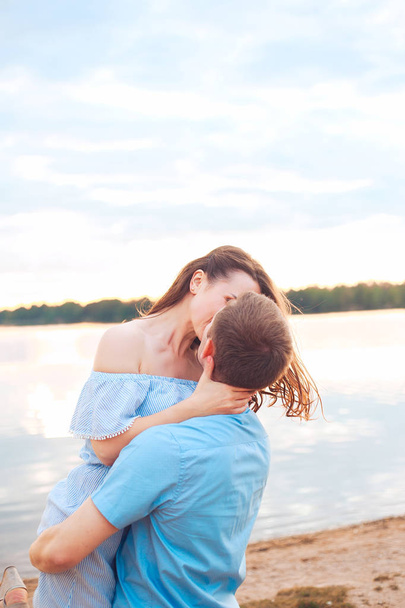 happy romantic couple in love and having fun at the lake outdoor in summer day, harmony concept - Photo, Image