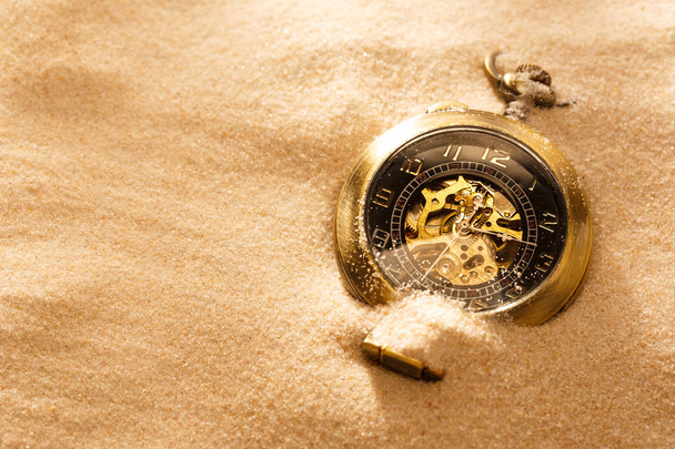 Pocket watch in beach sand - Foto, Imagen