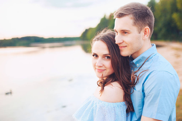 happy romantic couple in love and having fun at the lake outdoor in summer day, beauty of nature, harmony concept - Photo, image