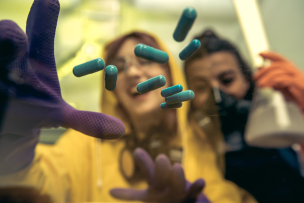women chemists at scientific laboratory with drugs - Photo, Image
