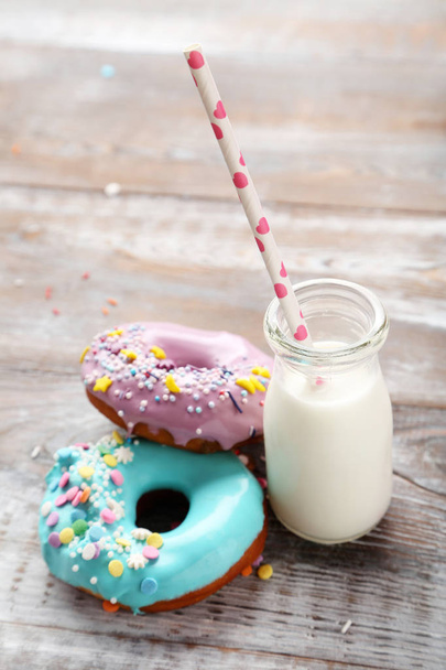 Tasty donuts with sprinkles - Фото, изображение