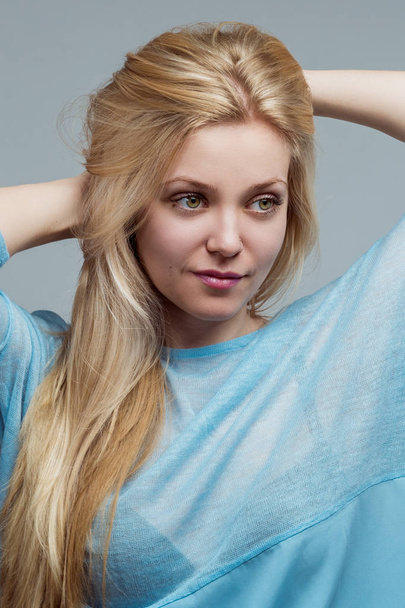 Portrait of a beautiful young blond woman - Fotoğraf, Görsel