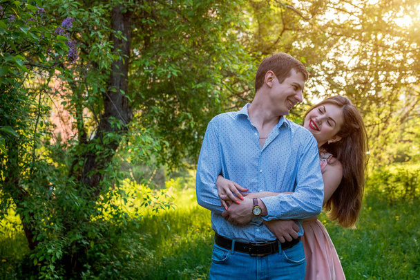Portrait of young love couple in the forest - Фото, зображення