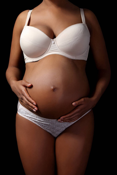 Close up of a cute pregnant belly - Foto, Imagem