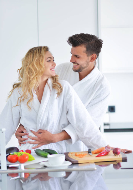 Happy couple cooking breakfast together  - Photo, Image