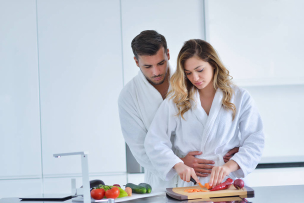 Happy couple cooking breakfast together  - Photo, Image