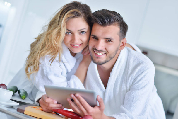 couple using tablet in the kitchen - 写真・画像