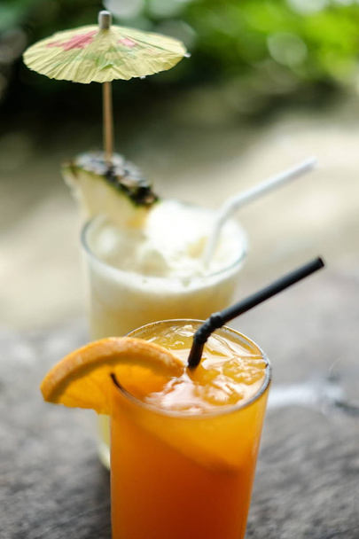 Fresh and refreshing cold orange and pineapple juice, for hot summer - Foto, Imagen