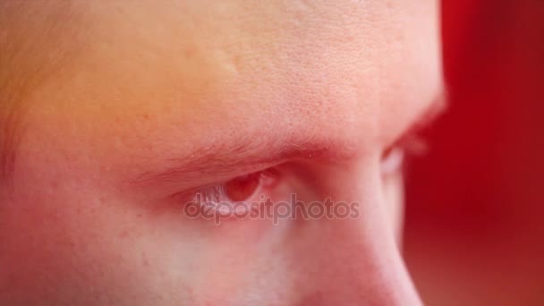 a young man with brown eyes looking to the side ,a computer effect - Footage, Video
