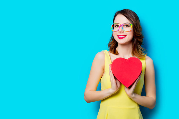 young woman with heart shaped gift  - Photo, Image