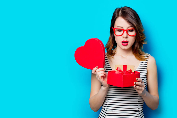 young woman with heart shaped gift  - 写真・画像