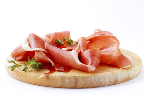  Smoked Parma ham on a wooden board - 写真・画像