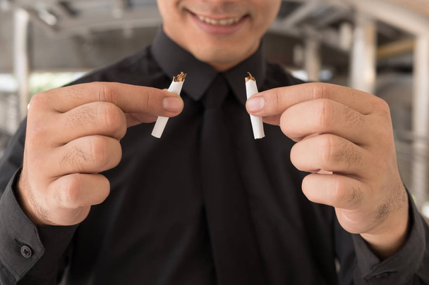 man quit smoking, breaking cigarette, concept of healthy lifesty - Photo, Image