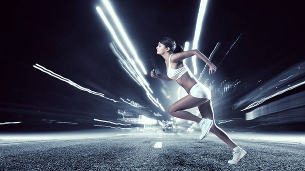 Young woman jogger - Фото, изображение
