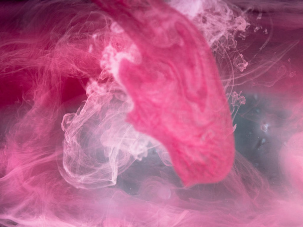 Abstract colored background. Colored smoke, ink in water, the patterns of the universe. Abstract movement, frozen multicolor flow of paint. Horizontal photo with soft focus, blurred backdrop - Fotoğraf, Görsel