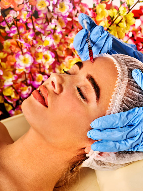 Dermal fillers of woman in spa salon with beautician. - Photo, Image