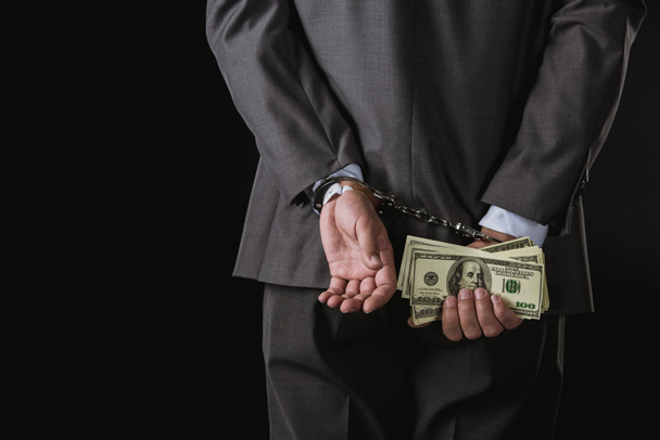businessman holding money - Foto, afbeelding