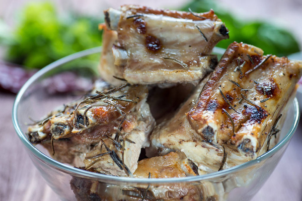 Roasted sliced barbecue pork ribs, focus on sliced meat - Photo, Image