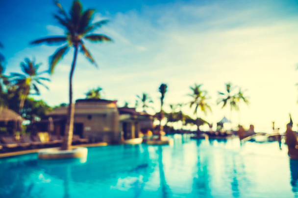 Silhouette coconut palm tree around swimming pool - Photo, Image