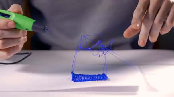 Hands building toy house using 3d pen. 4K. - Video