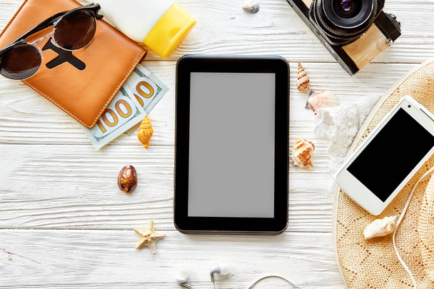 tablet, camera, sunglasses, passport and phone  - Foto, afbeelding