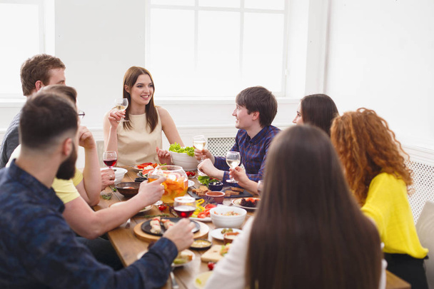 Group of happy people at festive table dinner party - Photo, Image