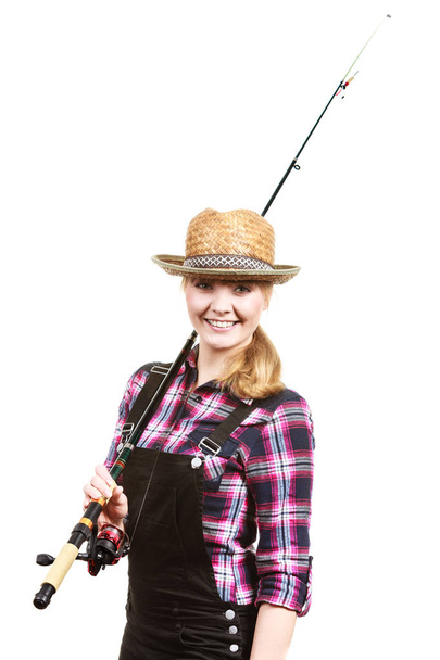 Happy woman in sun hat holding fishing rod - 写真・画像