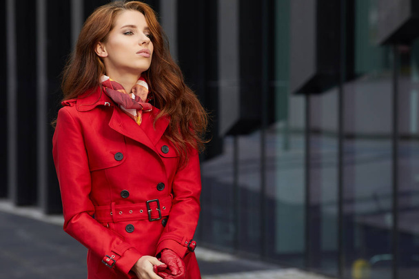 Spring woman in red coat - Фото, изображение