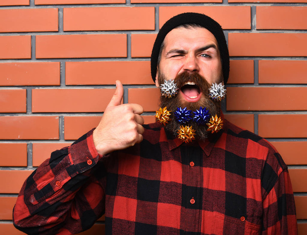 Bearded man, brutal caucasian amused hipster with gift decorative stars - Фото, зображення