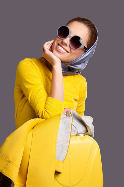 Lovely woman in a yellow sweater - Фото, зображення