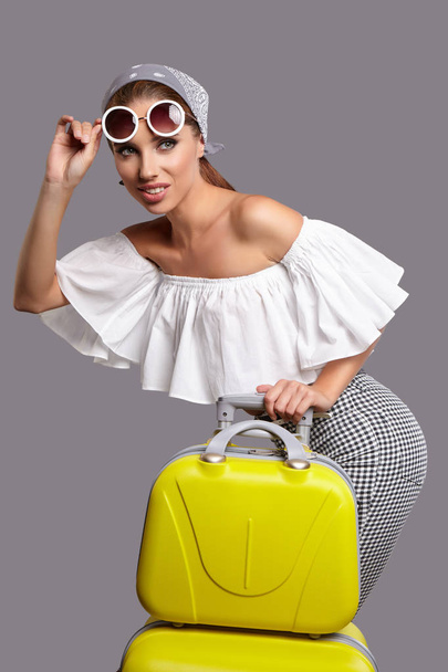 Glamour woman with yellow suitcase - Fotoğraf, Görsel