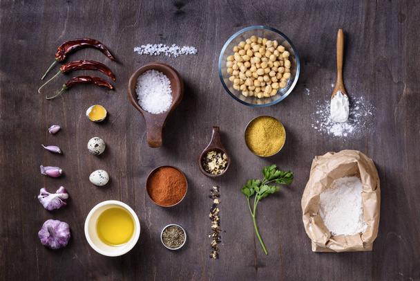 Raw cooking ingredients flat lay on wooden table.  - Photo, image