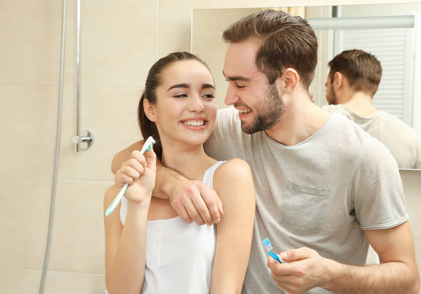 Young couple brushing teeth   - Zdjęcie, obraz
