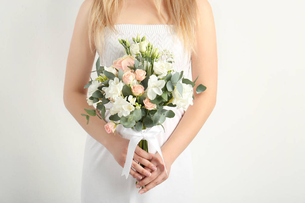Beautiful bride holding bouquet  - Фото, зображення
