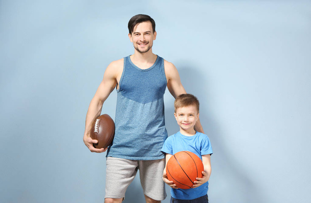 Father and son with balls  - Фото, зображення