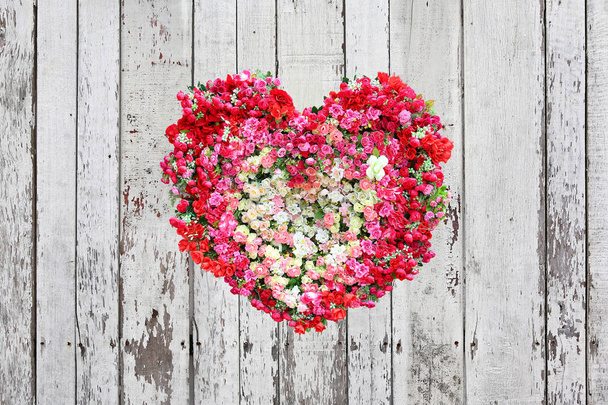 Valentines Day, Heart Made of Roses flower on wood plank background. - Photo, image