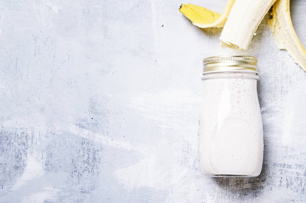 Banana smoothie in a bottle - Photo, image