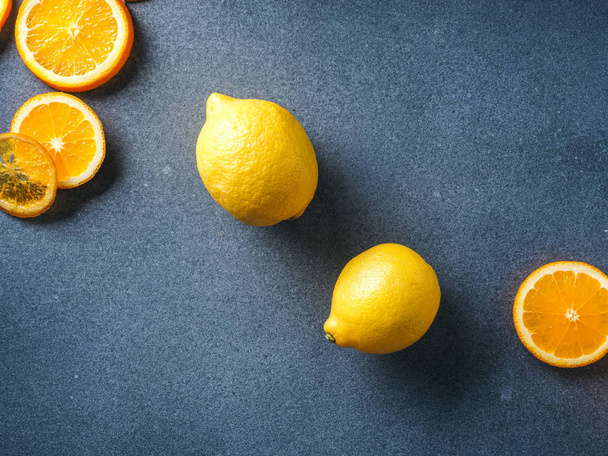 Fresh lemons and lemons slices - Zdjęcie, obraz