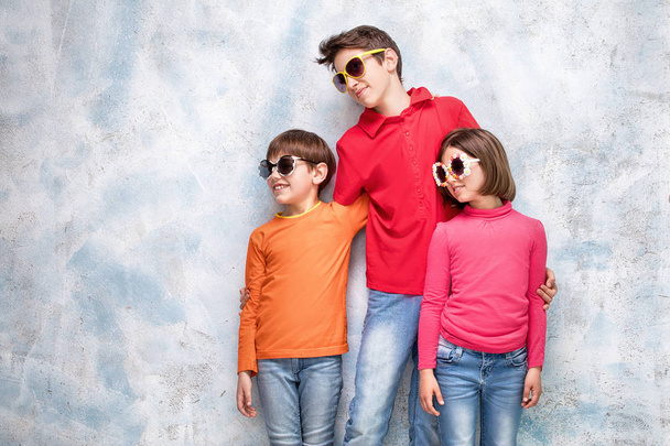 Happy children in sunglasses. - Фото, изображение