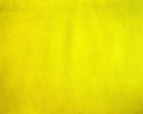 Closeup on old yellow leather and texture background, Yellow color blank surface background with space for text, sign and luxury style design - Photo, Image