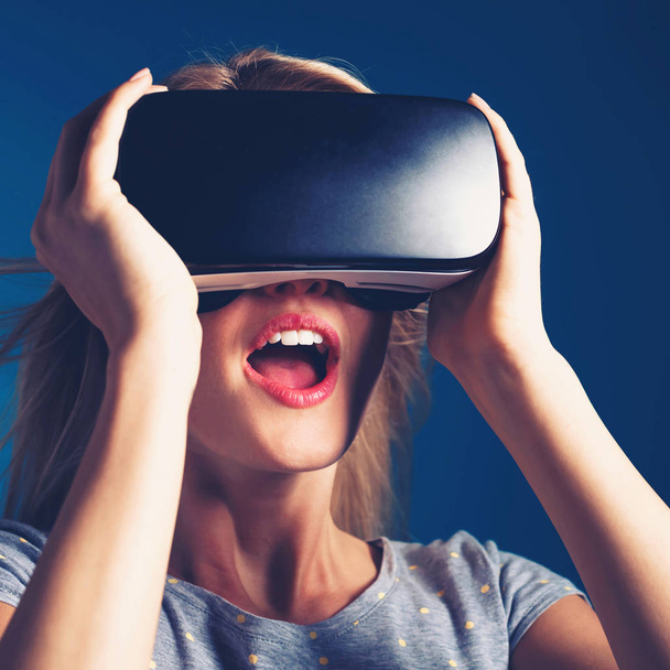 woman using virtual reality headset - 写真・画像