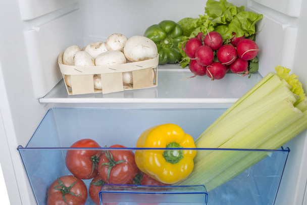 Open fridge full of fresh fruits and vegetables - Zdjęcie, obraz