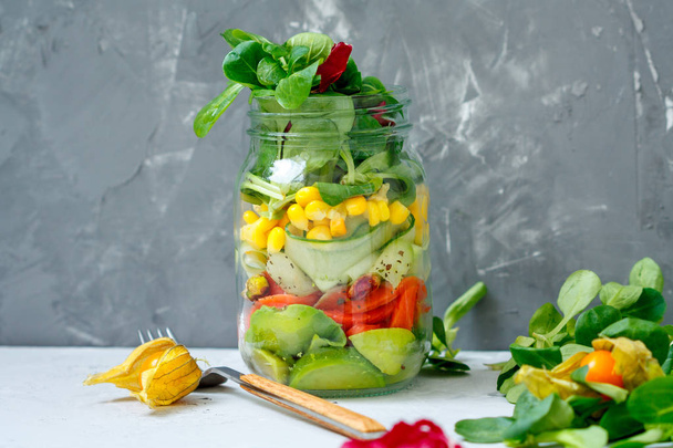 Healthy take-away lunch jar with salmon, cucumber and avocado. - Fotoğraf, Görsel
