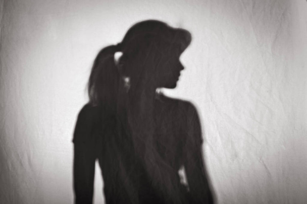 silhouette of woman profile on white texture - Фото, изображение
