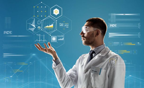 doctor or scientist in lab coat and safety glasses - Zdjęcie, obraz