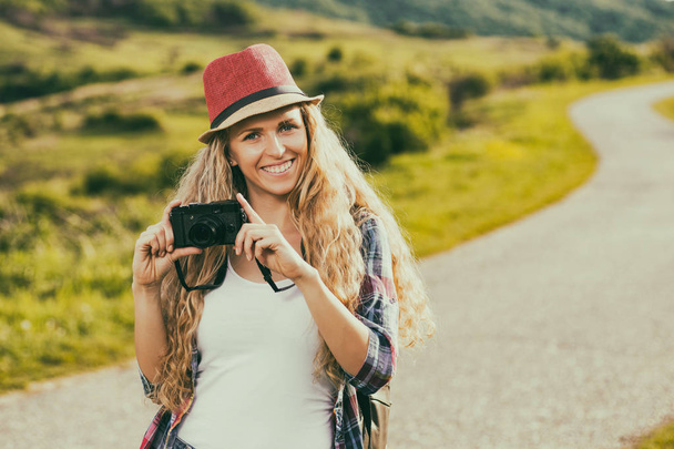 Woman with camera at the country - Foto, imagen