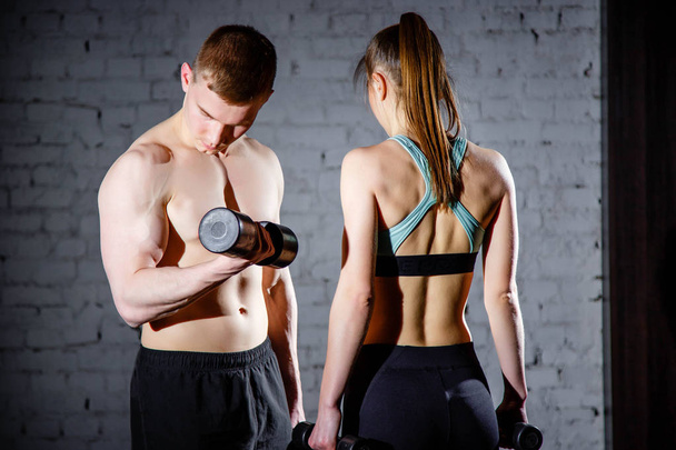 Athletic couple poses for the camera - Photo, image