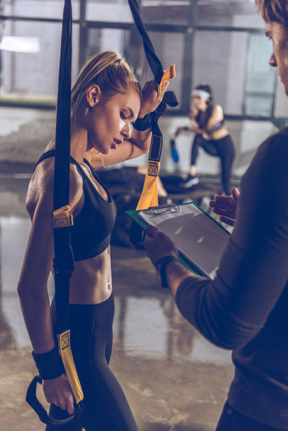 sportive woman with trx equipment - Photo, Image