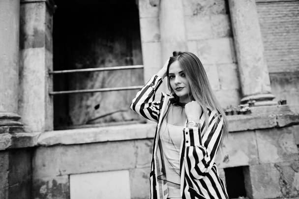 Fashionable woman look with black and white striped suit jacket, - Foto, immagini